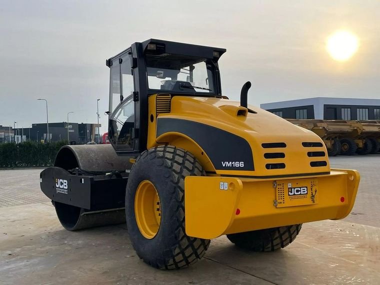 JCB Vibromax VM166 single-drum soil compactor at sunset in the trading yard